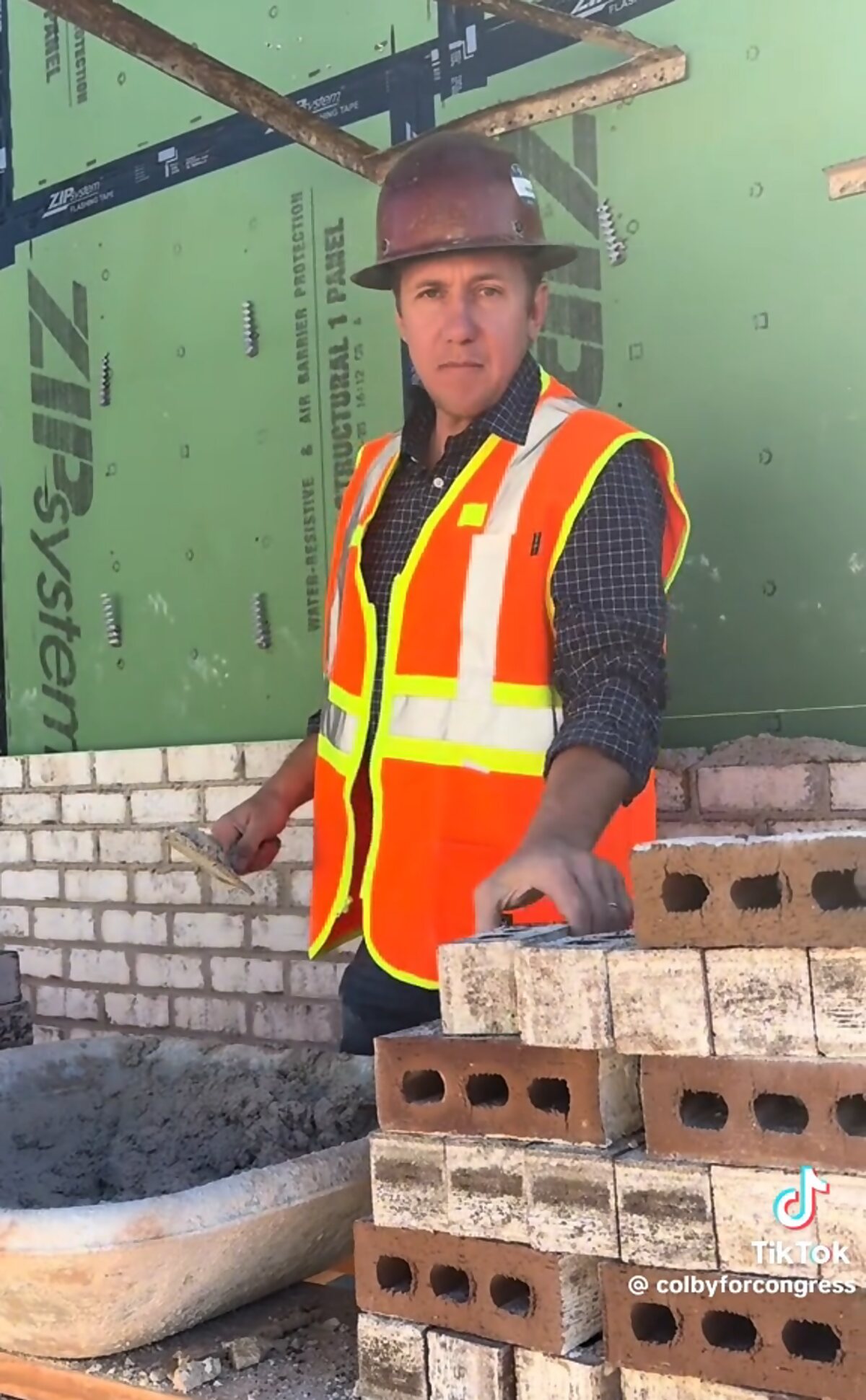 Colby Watson laying brick on the job