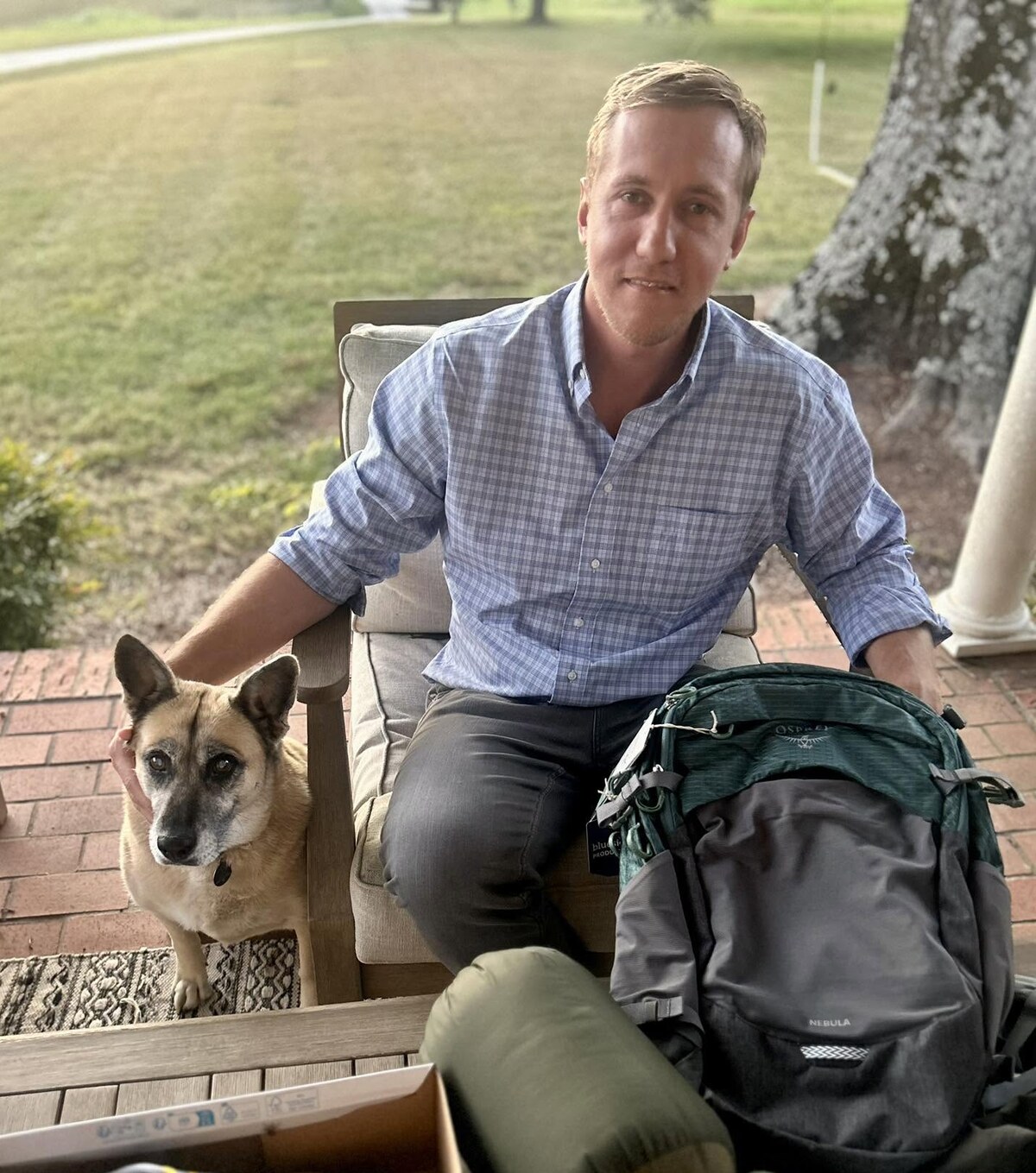 Colby Watson at home with his dog
